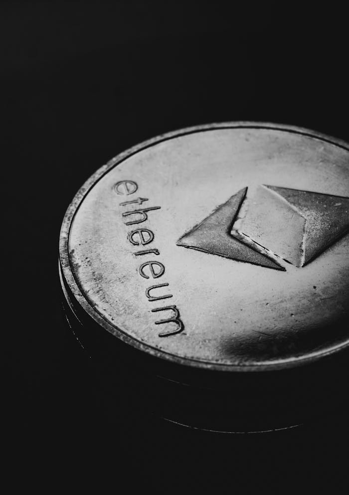 Close-up of an Ethereum coin on a dark background highlighting crypto finance concept.